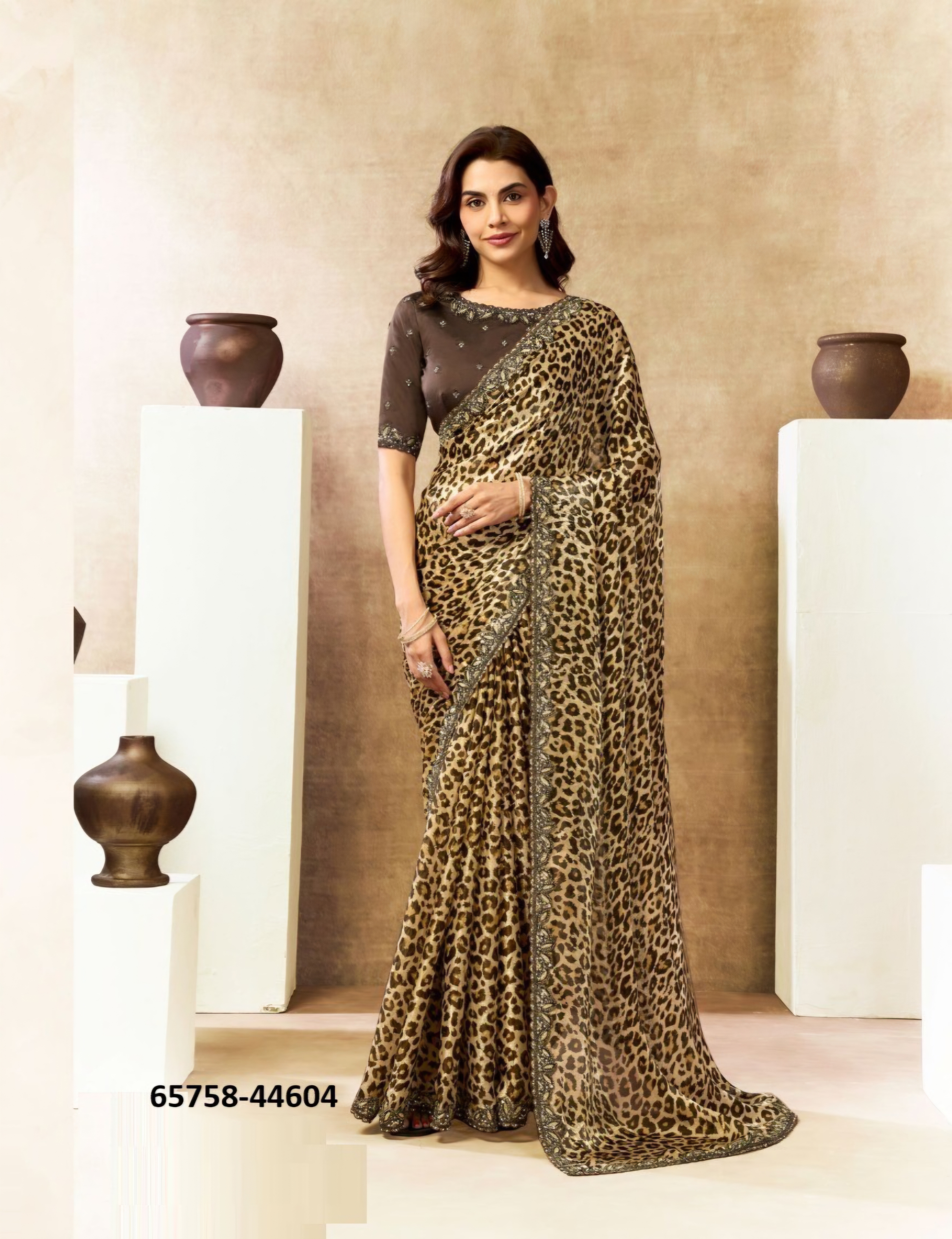 Turn heads in this stunning leopard print saree featuring intricate embellished borders and a beautifully detailed blouse.